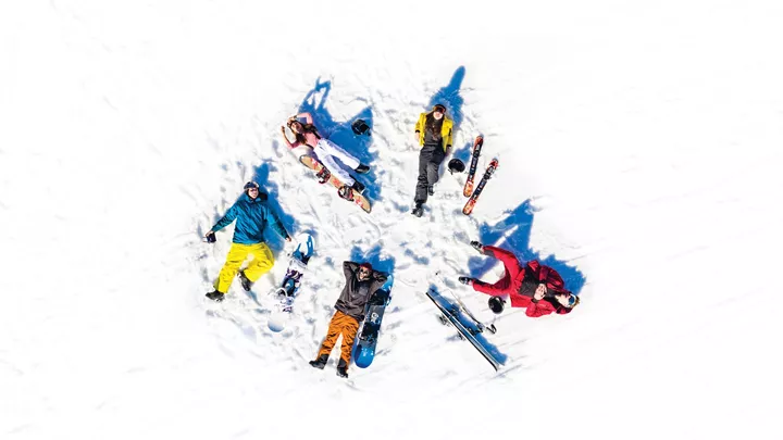 Aerial shot of Travellers making Snow Angels in Hopfgarten, Austria