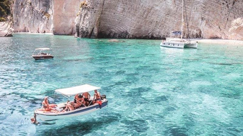 Group sailing in the clear ocean in Greece