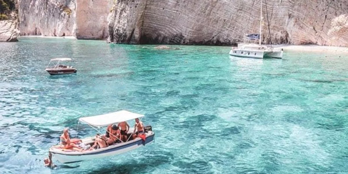 Group sailing in the clear ocean in Greece