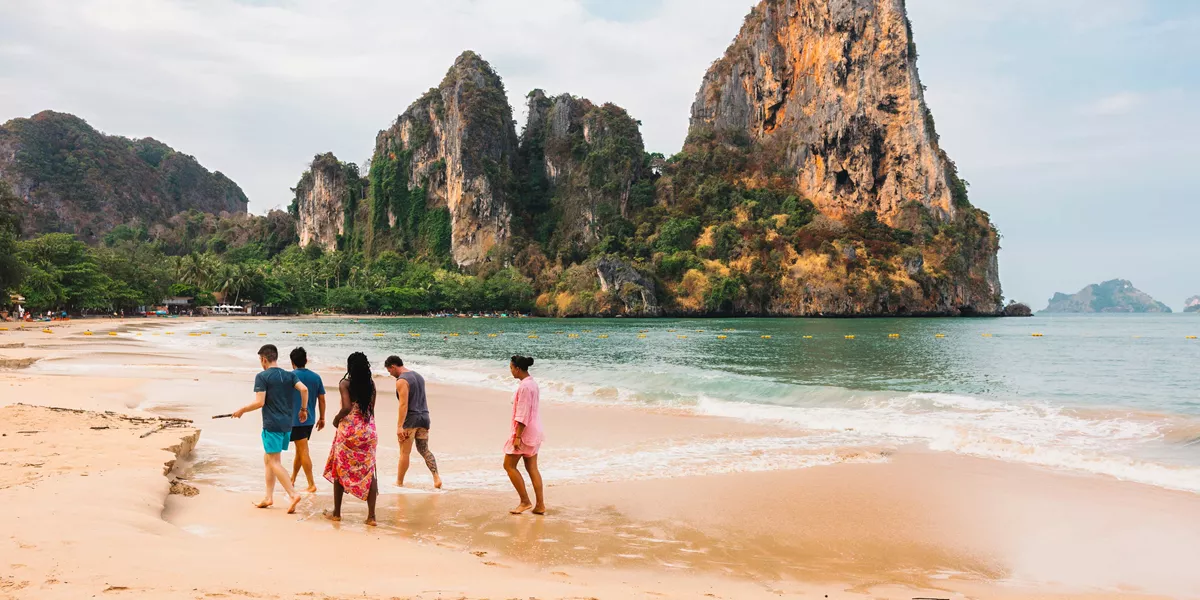 Group Walking On Thai Beach (1)