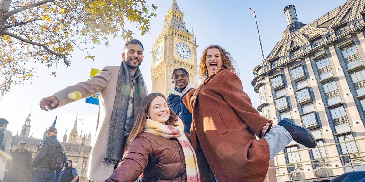 Group Of Friends Smiling Big Ben At The Back