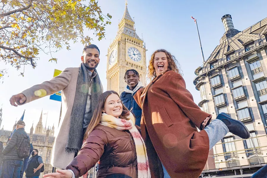 Group Of Friends Smiling Big Ben At The Back