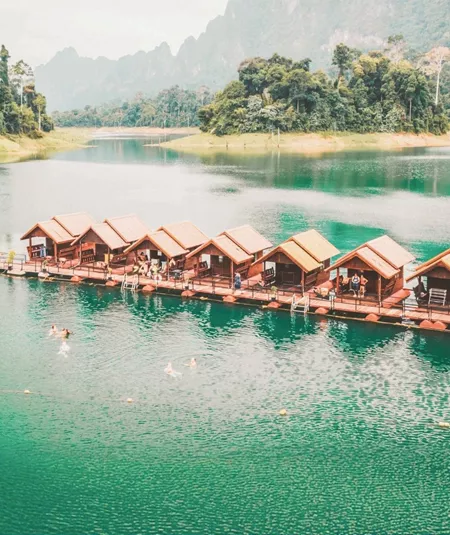 Floating raft houses surrounded by rainforest in Khao Sok National Park - Contiki Southern Thailand to Singapore Tour