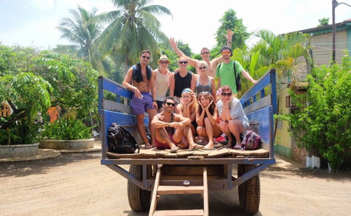 Group Of Young People At The Back Of A Jeep Sunny Day