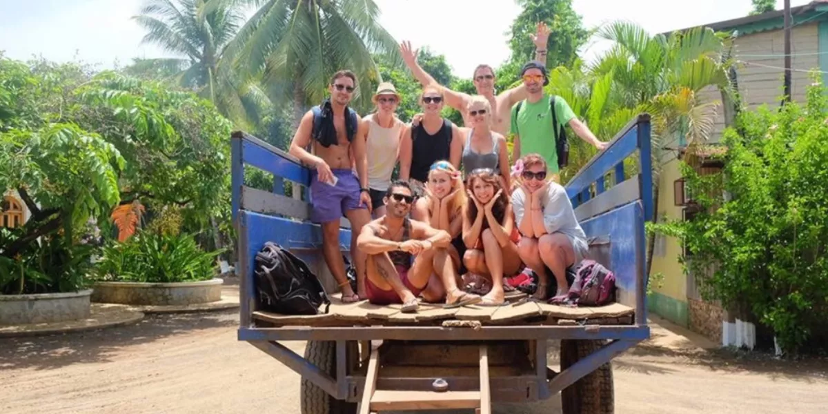 Group Of Young People At The Back Of A Jeep Sunny Day
