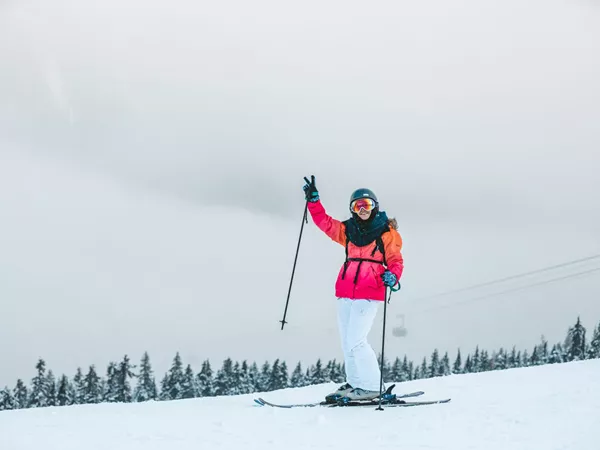 Person Skiing And Smiling
