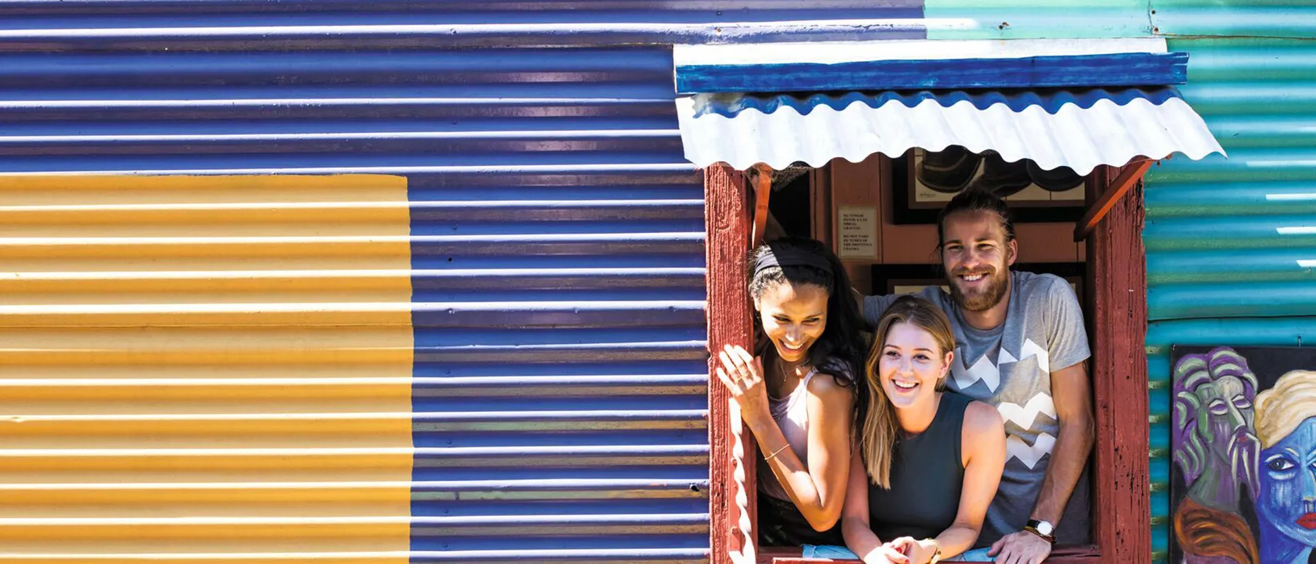 Travellers smiling in La Boca district, Buenos Aires Travellers smiling in La Boca district, Buenos Aires