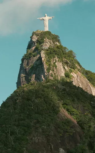 Christ the Redeemer overlooks Rio de Janeiro from Corcovado Mountain on the Contiki Best of Argentina & Brazil Tour