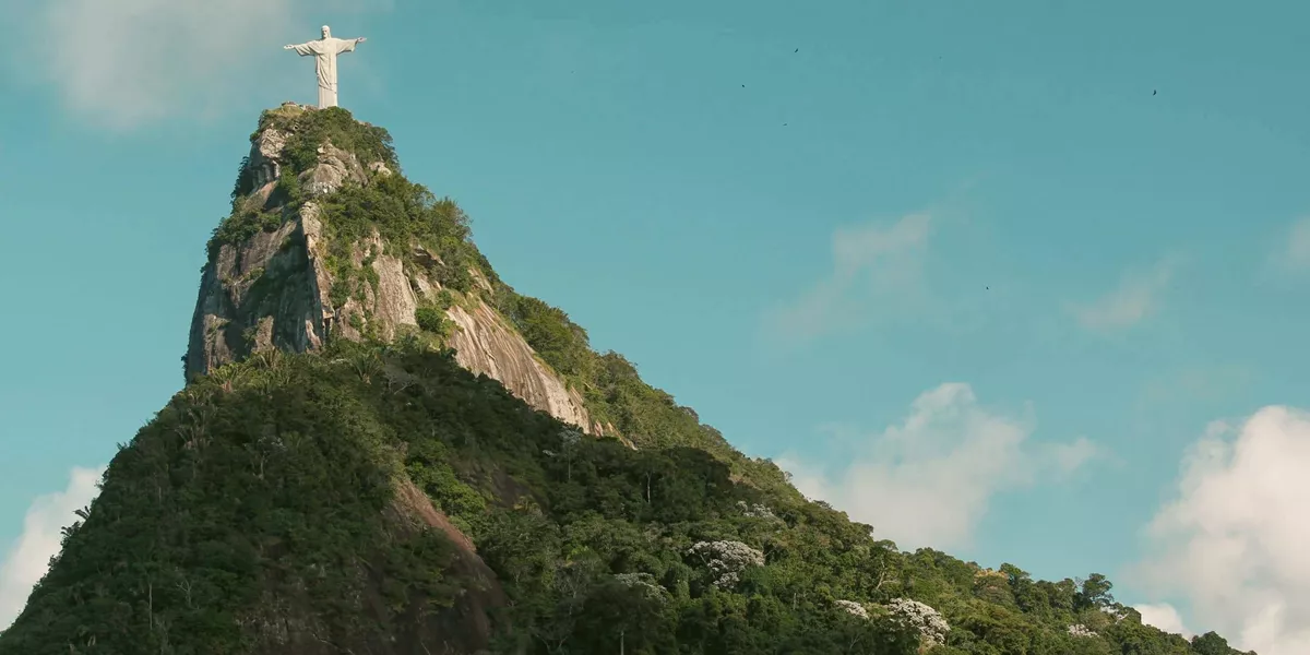 Christ the Redeemer overlooks Rio de Janeiro from Corcovado Mountain on the Contiki Best of Argentina & Brazil Tour