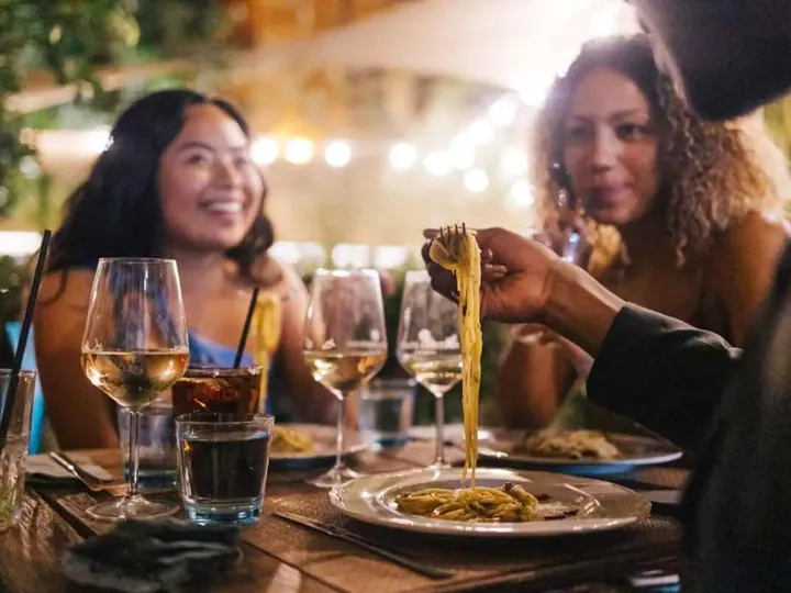 Travelers Eating Pasta In Sicily Italy