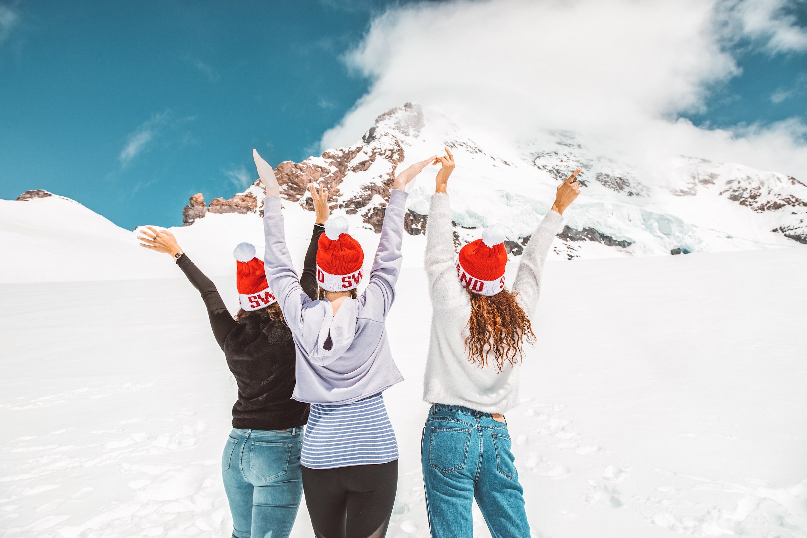 Travellers celebrating at the top of Jungfrau, Lauterbrunnen, Switzerland