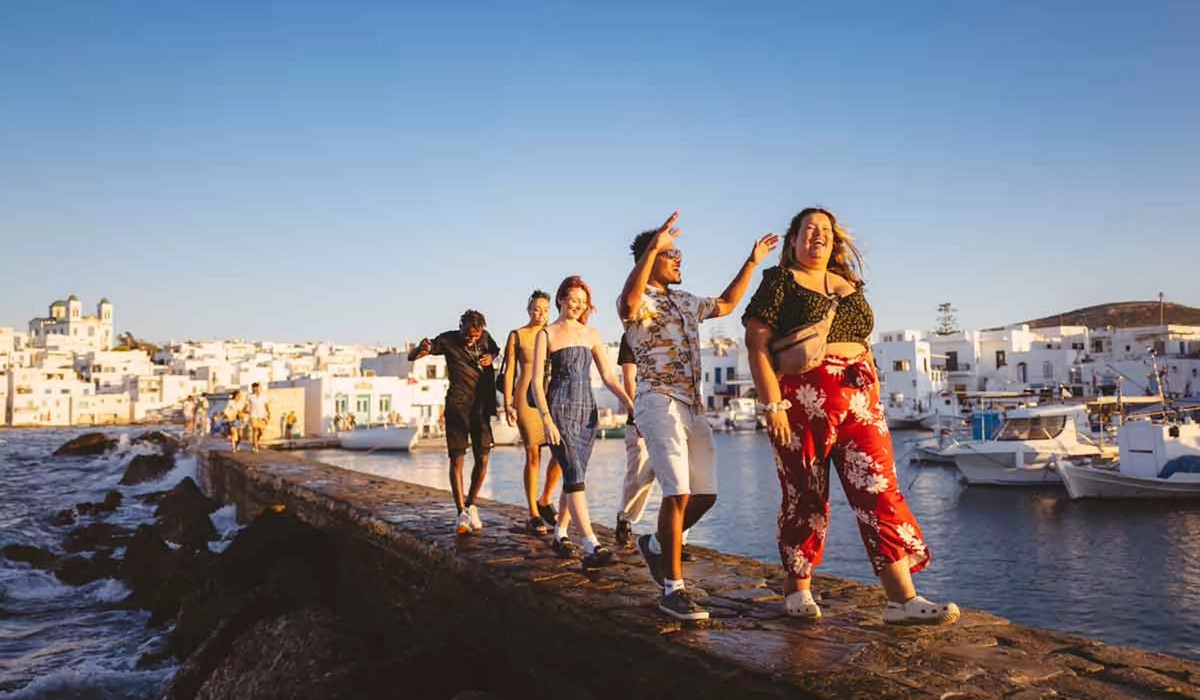 People Walking In Sun Greece