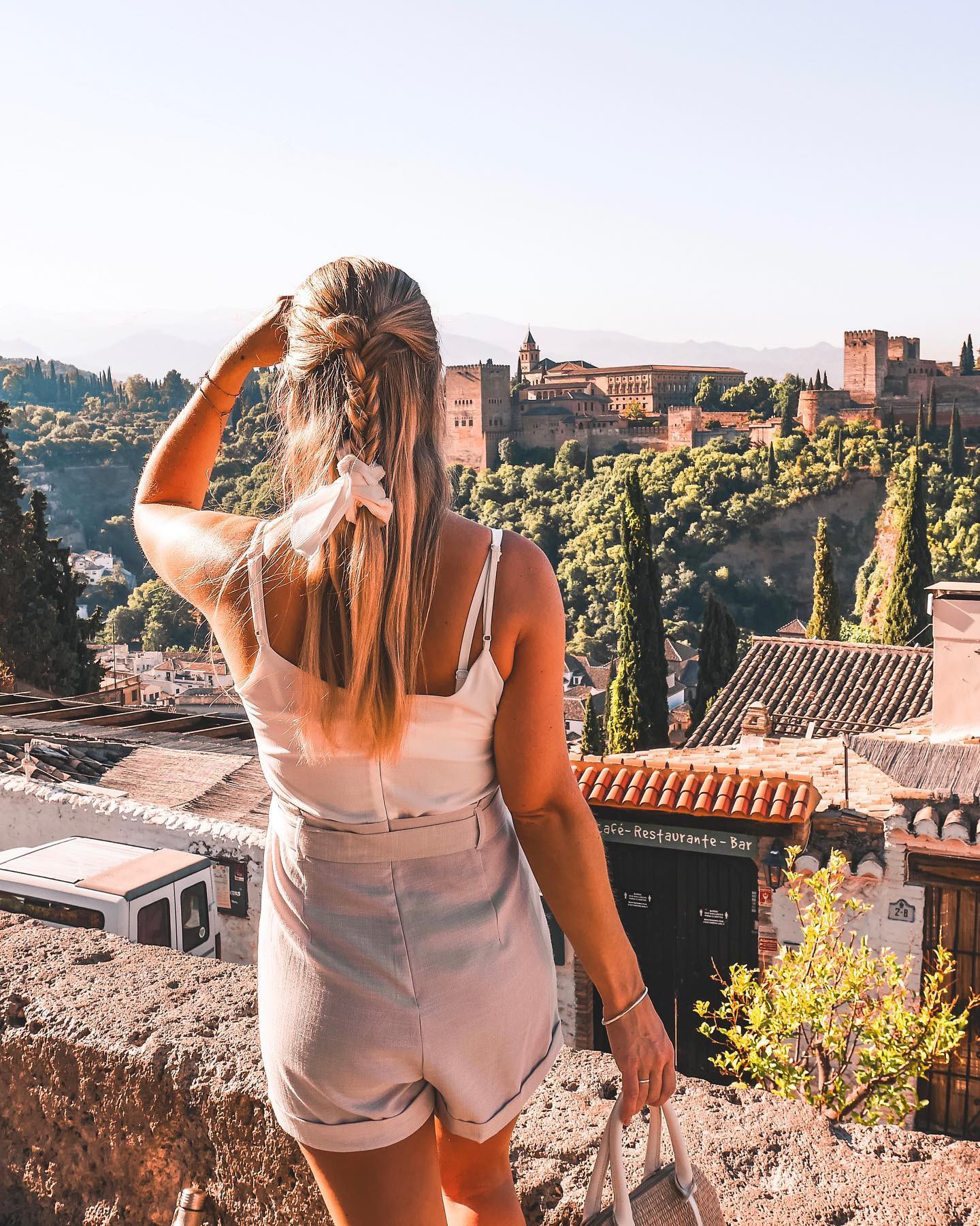 Traveller looking at the Alhambra from the Albaicin District in Grenada, Spain