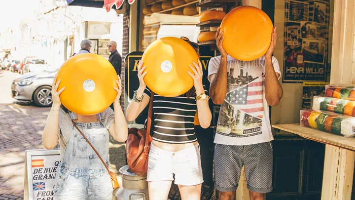 Travellers at a Dutch cheese shop in Amsterdam, Netherlands