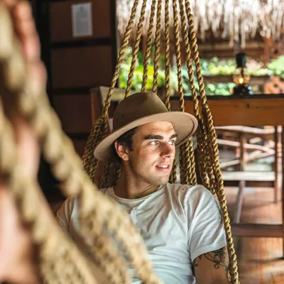A man relaxing in a hammock