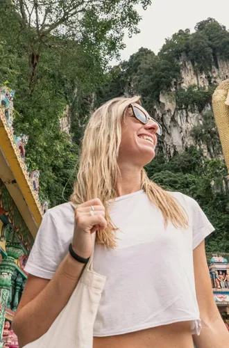 Traveller explores Batu Caves and the golden Lord Murugan statue on the Contiki Thailand, Malaysia & Singapore Tour