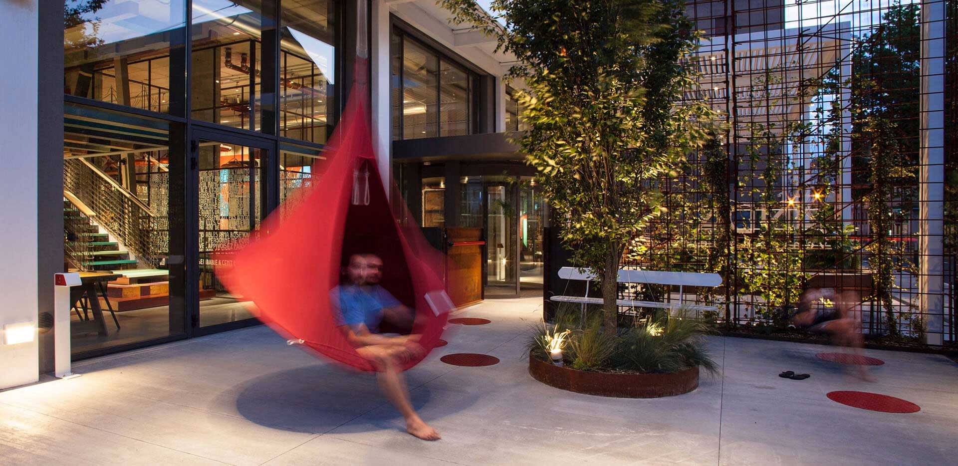 Man moving in hanging tent in Anda Venice Hotel