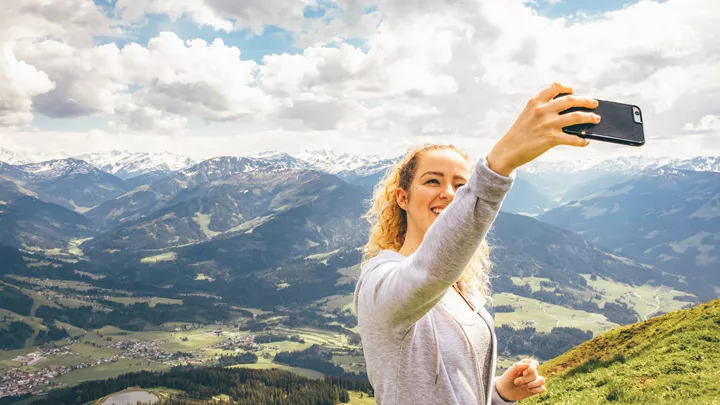 Traveller on top of a mountain in the Austrian Tyrol, Austria