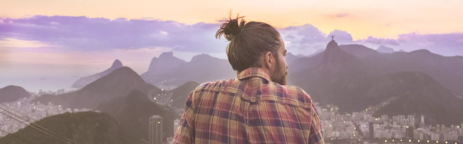 Man looking at a mountain landscape in Brazil.