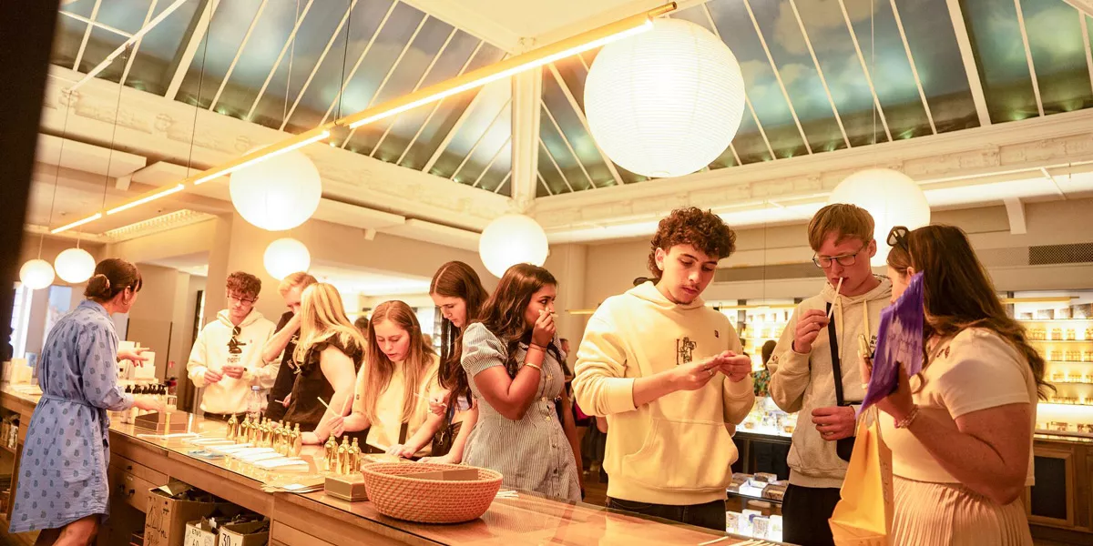 People Visiting A Perfumery