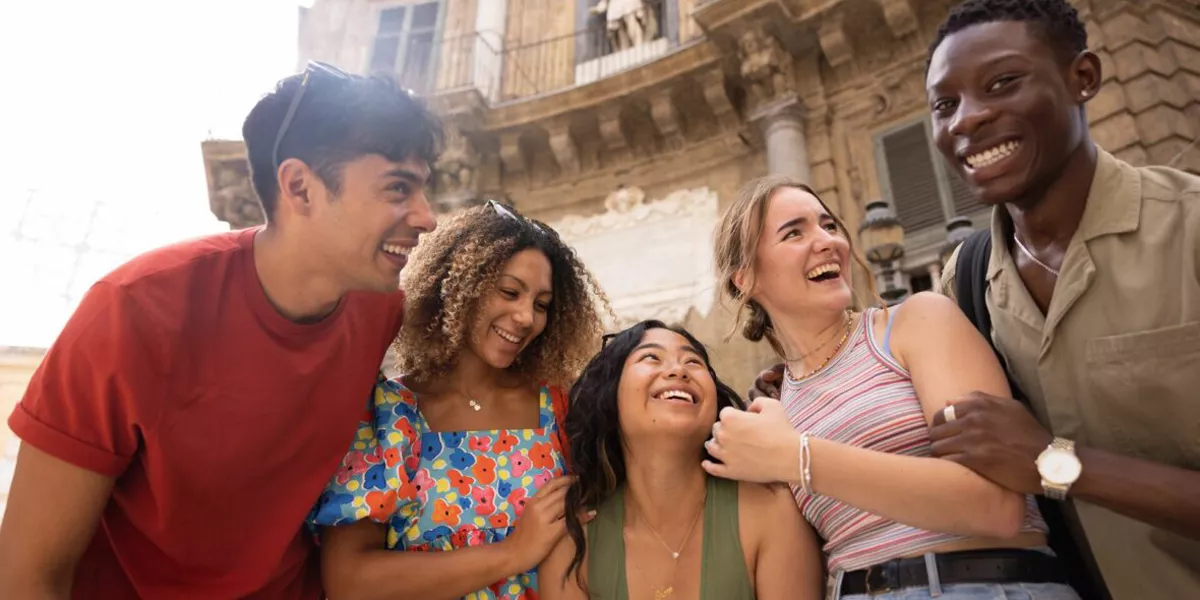 Group Of Friends Laughing In Italy