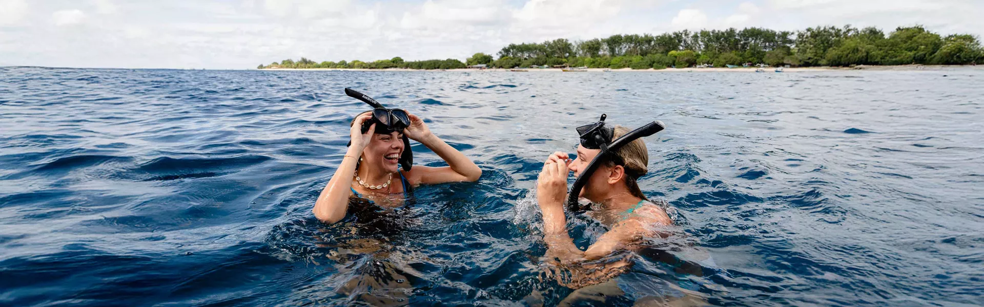Two Female Snorkellers In Ocean