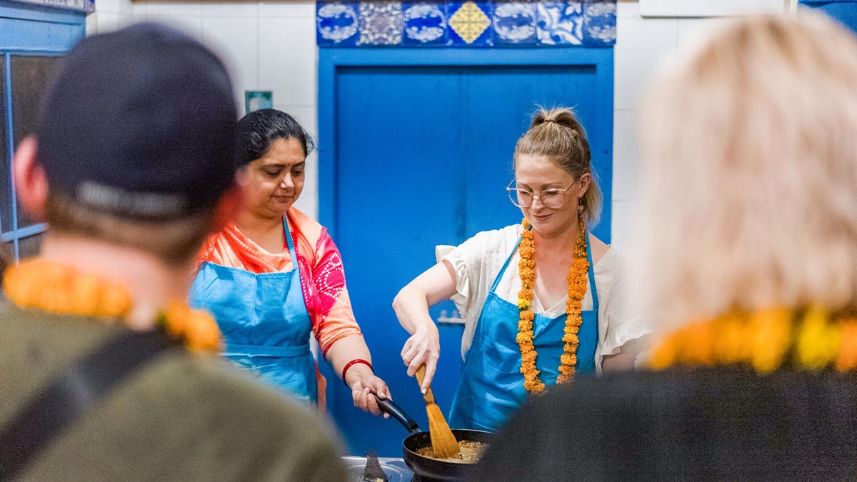 Woman Learning To Cook From A Local Person