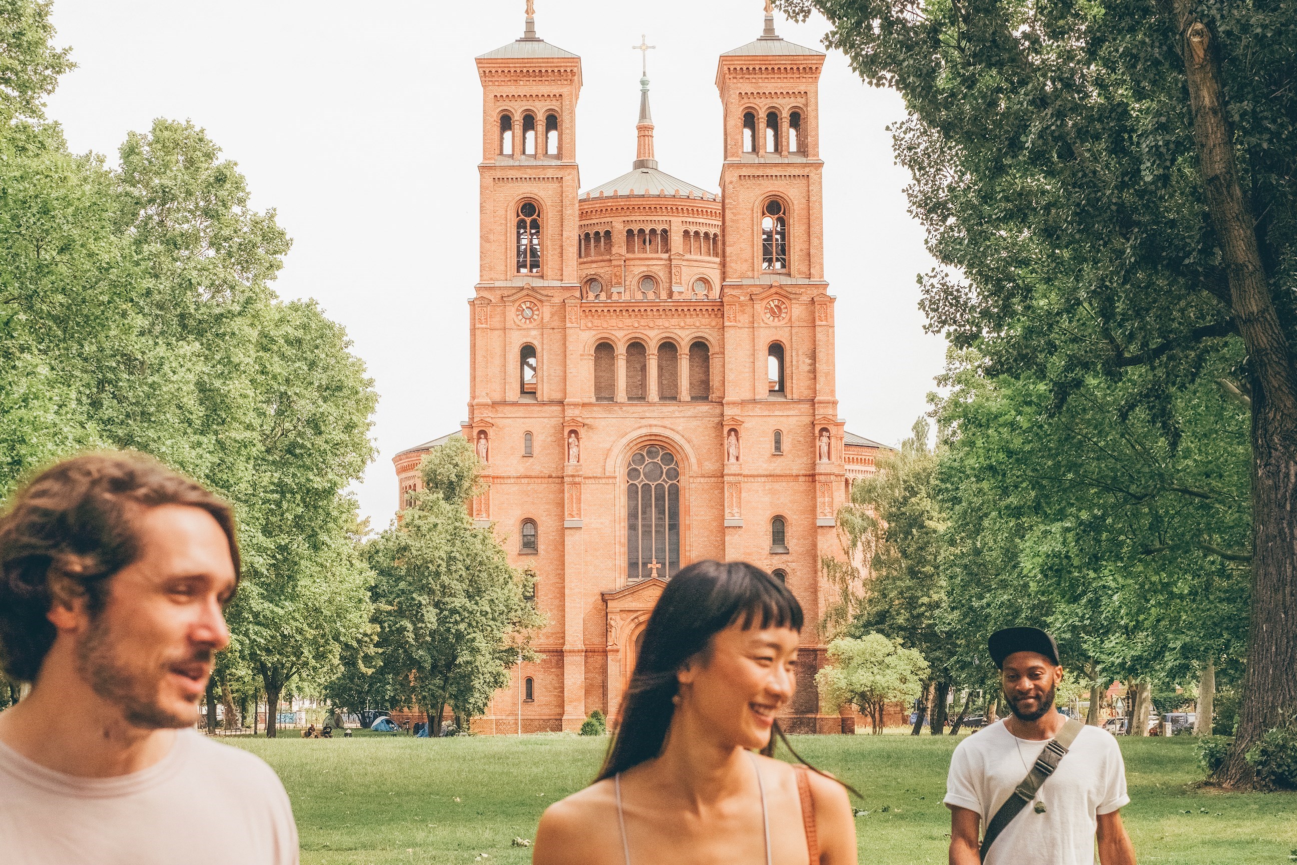 Travellers outside St. Thomas Church in Berlin, Germany