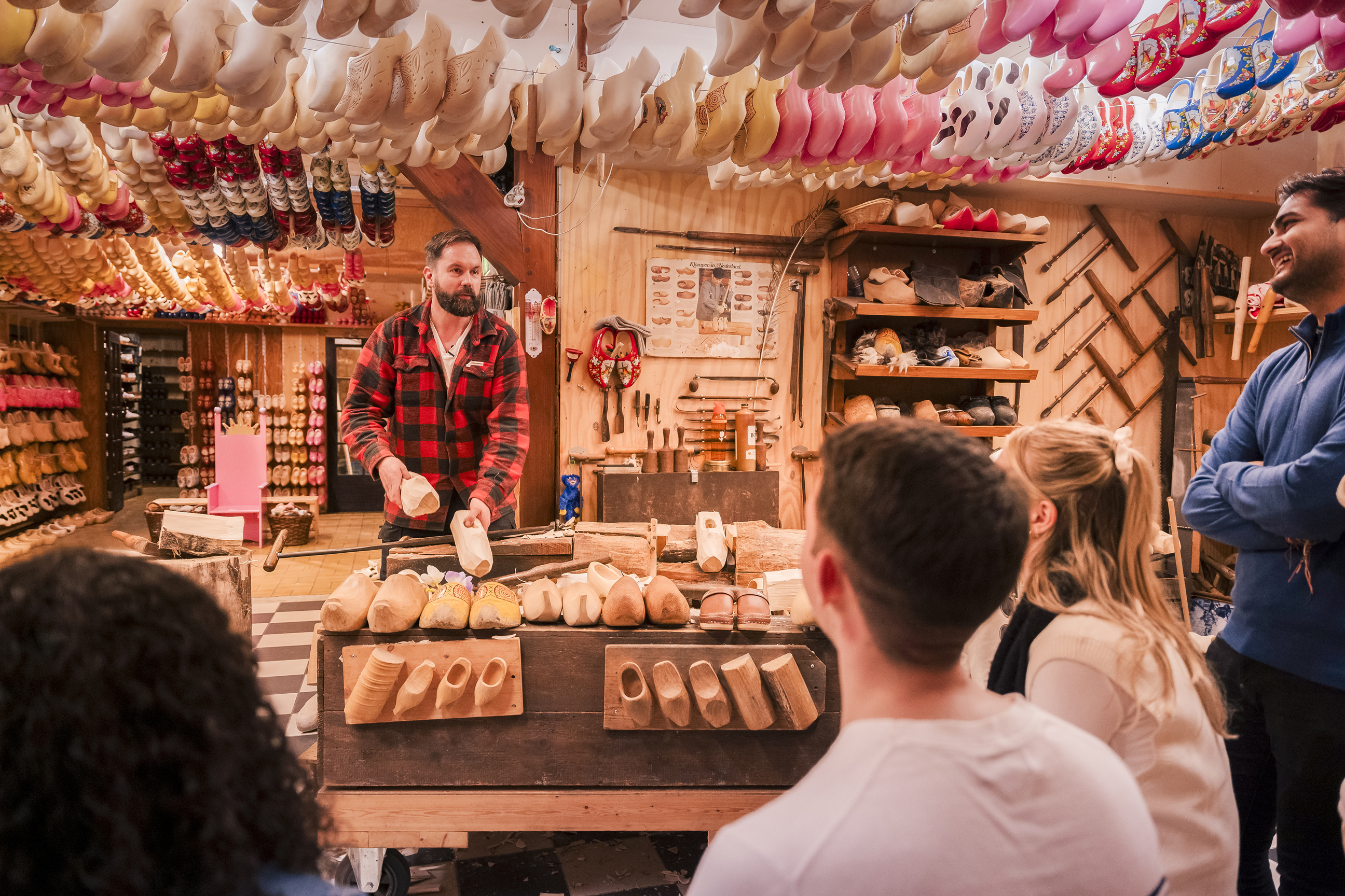 Travellers watching a clog maker in Edam, Netherlands