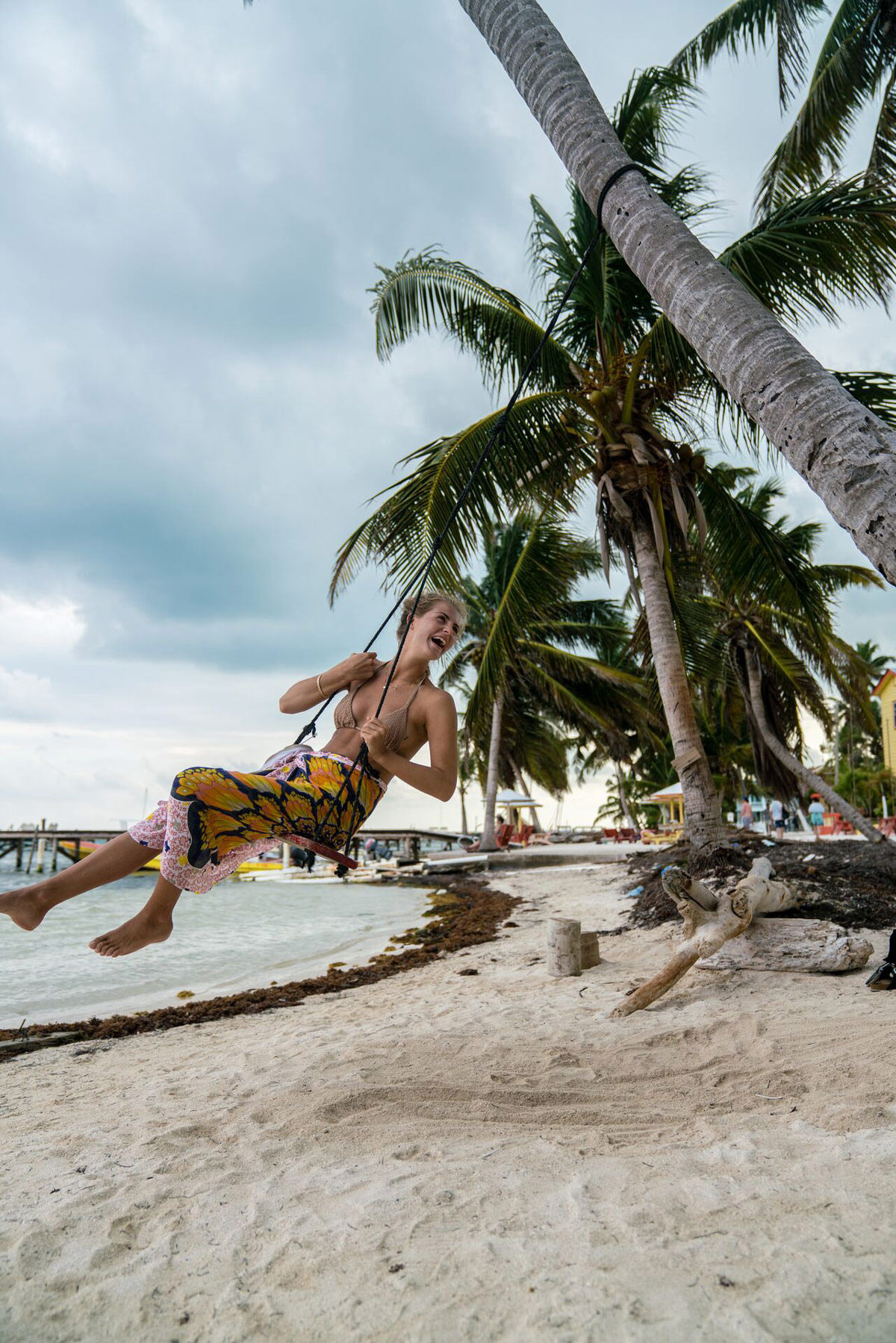 Girl On Swing On Beach In Belize