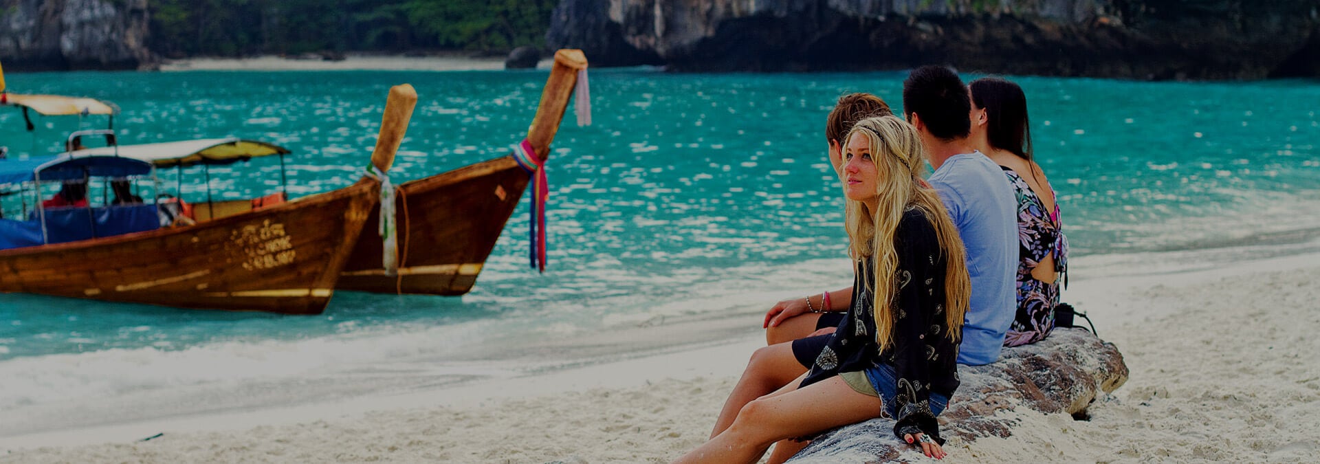 People sitting on beach of Koh Samui in Thailand