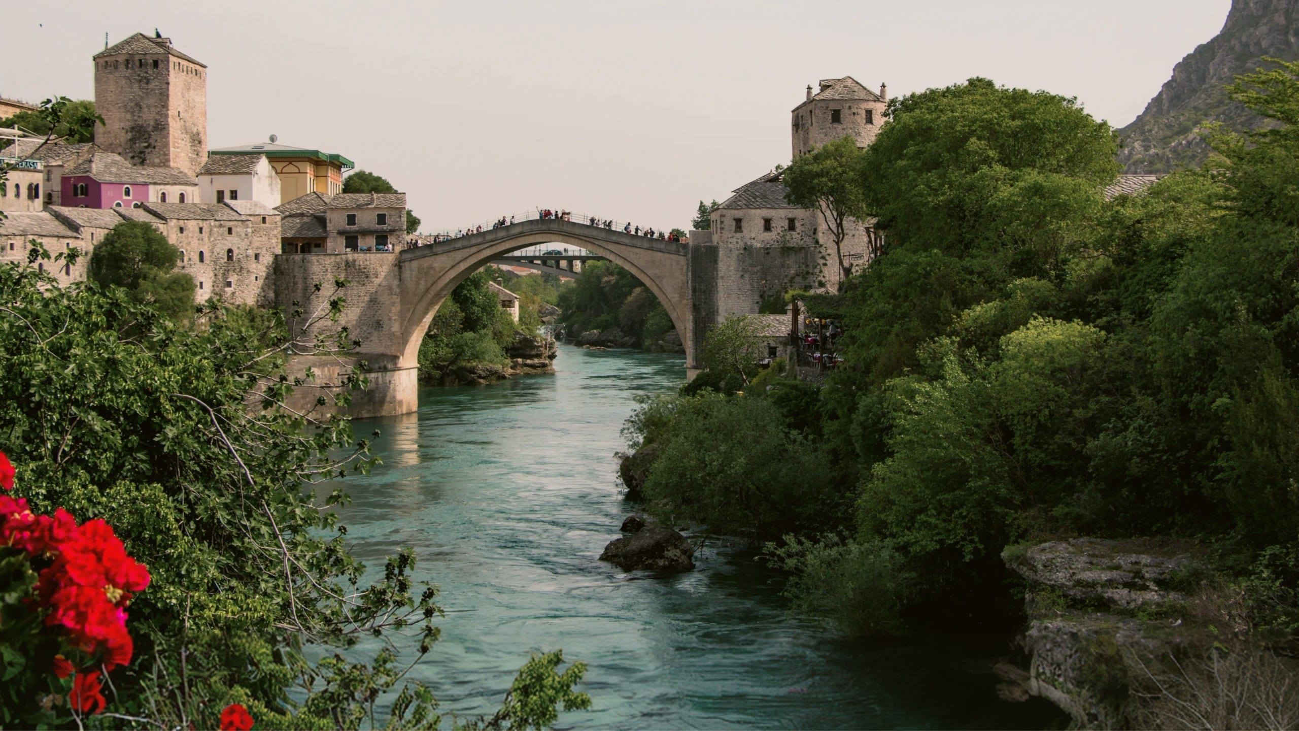 The iconic Stari Most bridge spans the Neretva River on the Contiki Dubrovnik to Budapest Tour