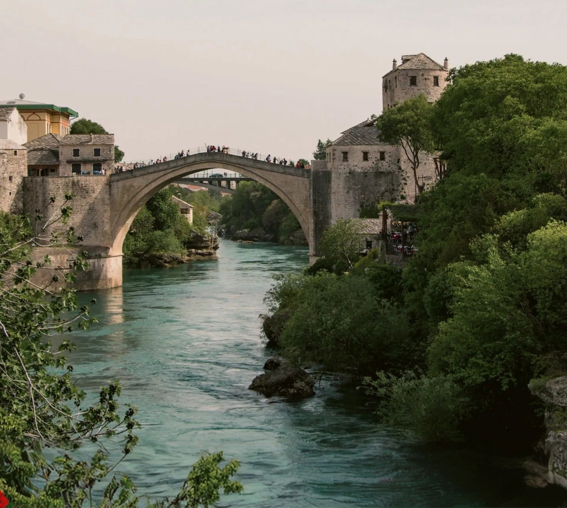 The iconic Stari Most bridge spans the Neretva River on the Contiki Dubrovnik to Budapest Tour