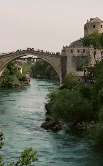 The iconic Stari Most bridge spans the Neretva River on the Contiki Dubrovnik to Budapest Tour