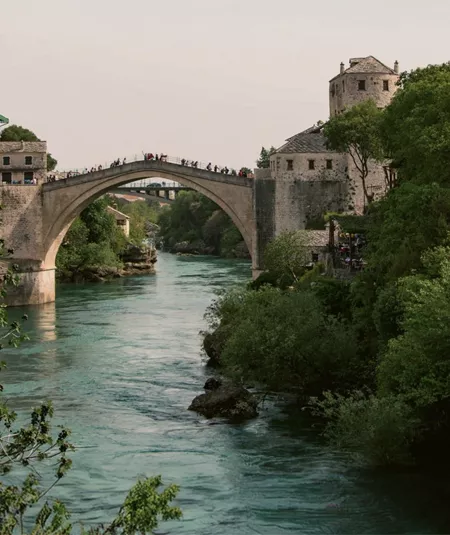 The iconic Stari Most bridge spans the Neretva River on the Contiki Dubrovnik to Budapest Tour