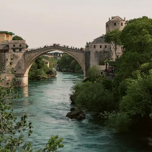 The iconic Stari Most bridge spans the Neretva River on the Contiki Dubrovnik to Budapest Tour