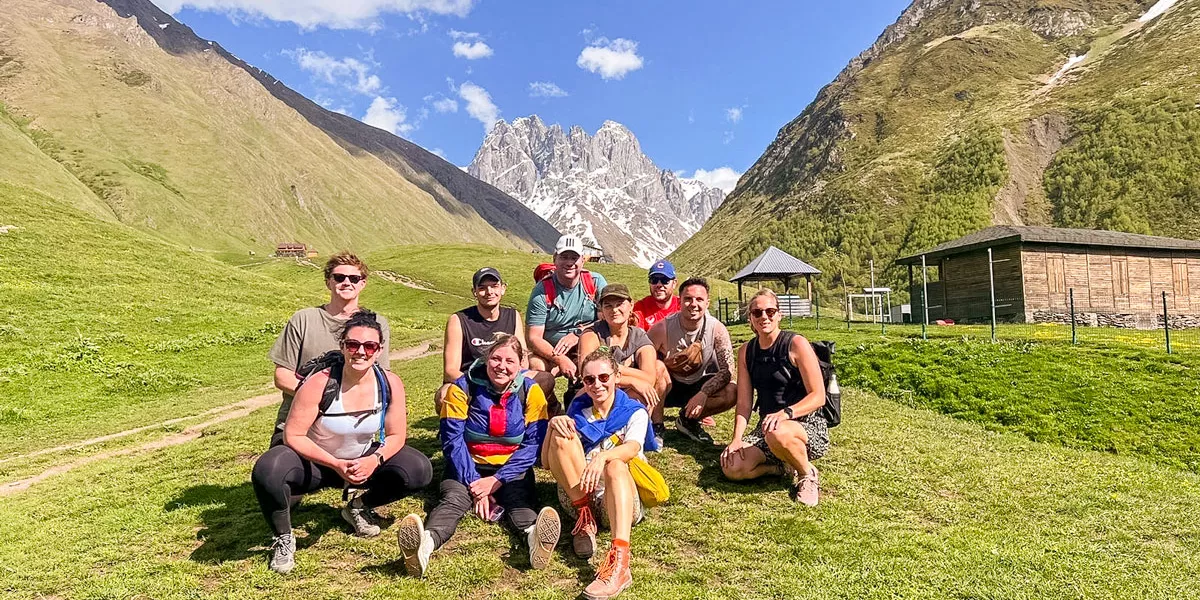 Group Of Friends Sitting On Grass