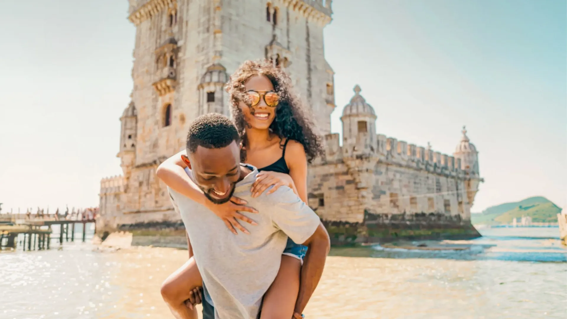 Two travellers exploring Belém Tower in Lisbon - Contiki Spain, Portugal & Morocco Trail Tour
