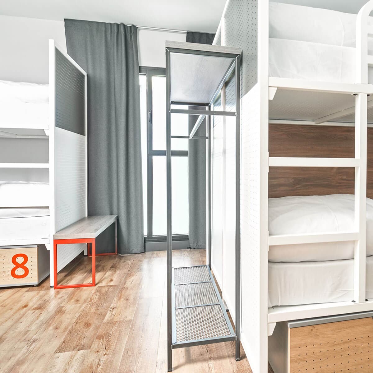 Generator Hostel room with beds and balcony door