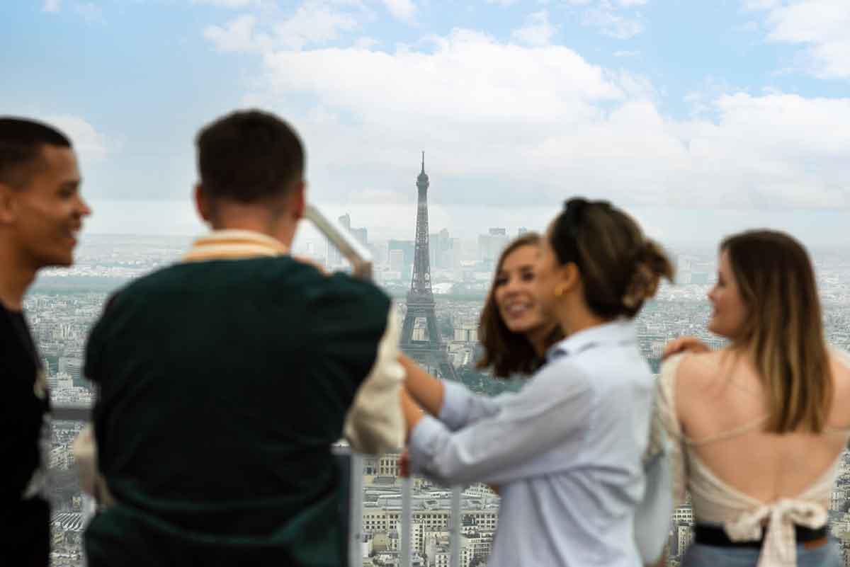 Travellers Enjoying A Scenic View Of The Eiffel Tower Paris France