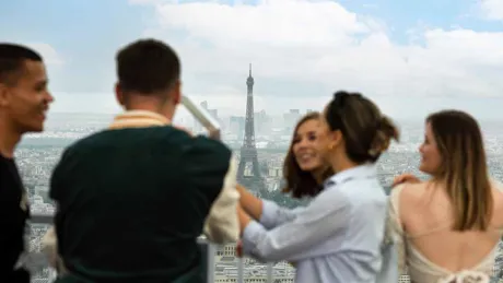 Travellers Enjoying A Scenic View Of The Eiffel Tower Paris France