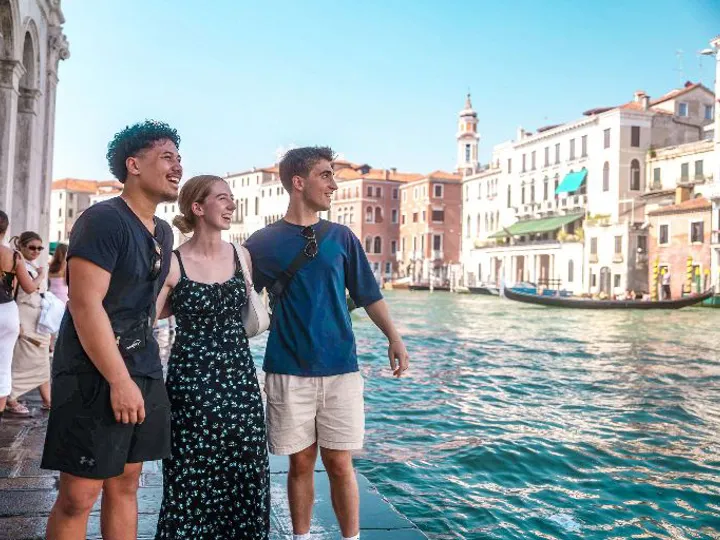 People Walking In Venice Close To Canal