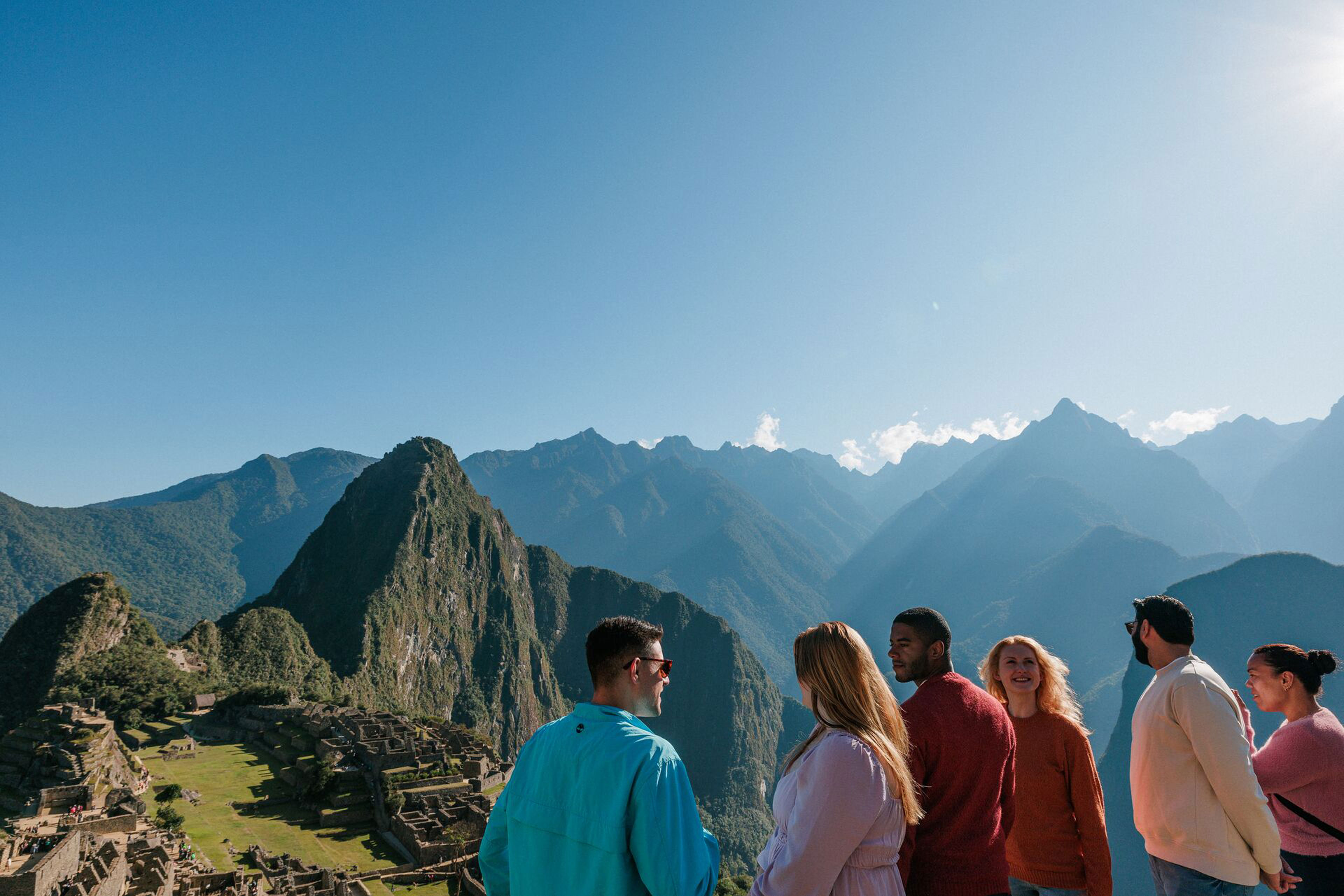 Friends Smiling At Each Other Mountains Landscape At The Back