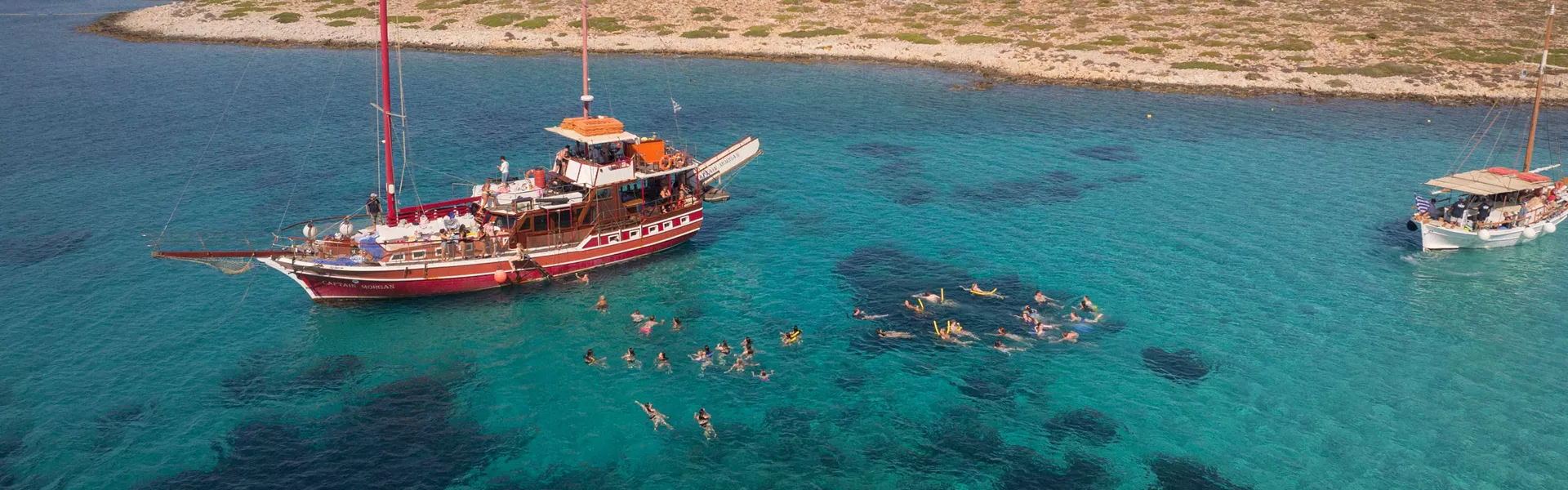 People On A Boat In Greece
