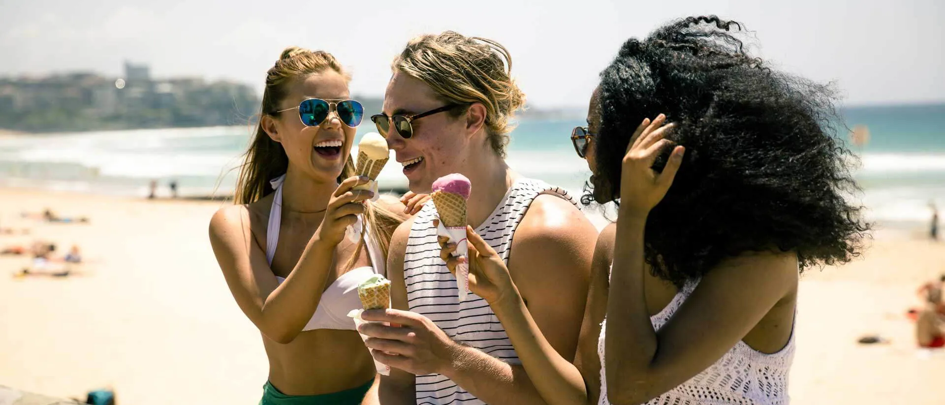 Group Near The Beach In Australia Eating Ice Creams