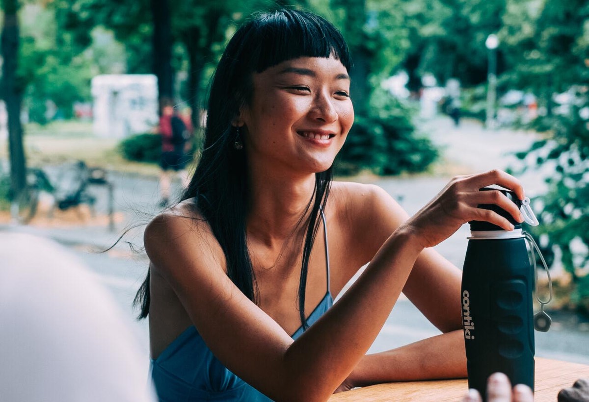 Traveller holding a Contiki reusable bottle in Berlin, Germany