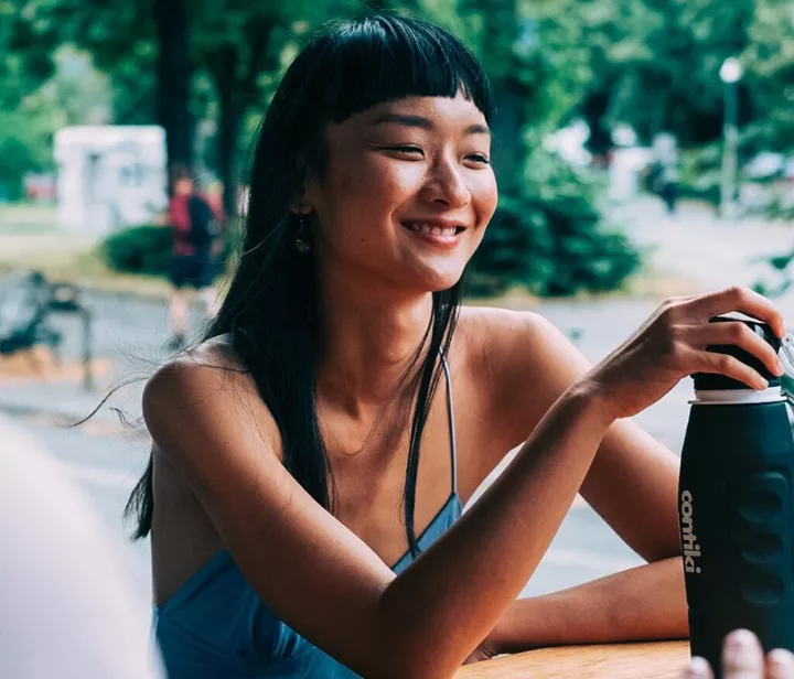 Traveller holding a Contiki reusable bottle in Berlin, Germany