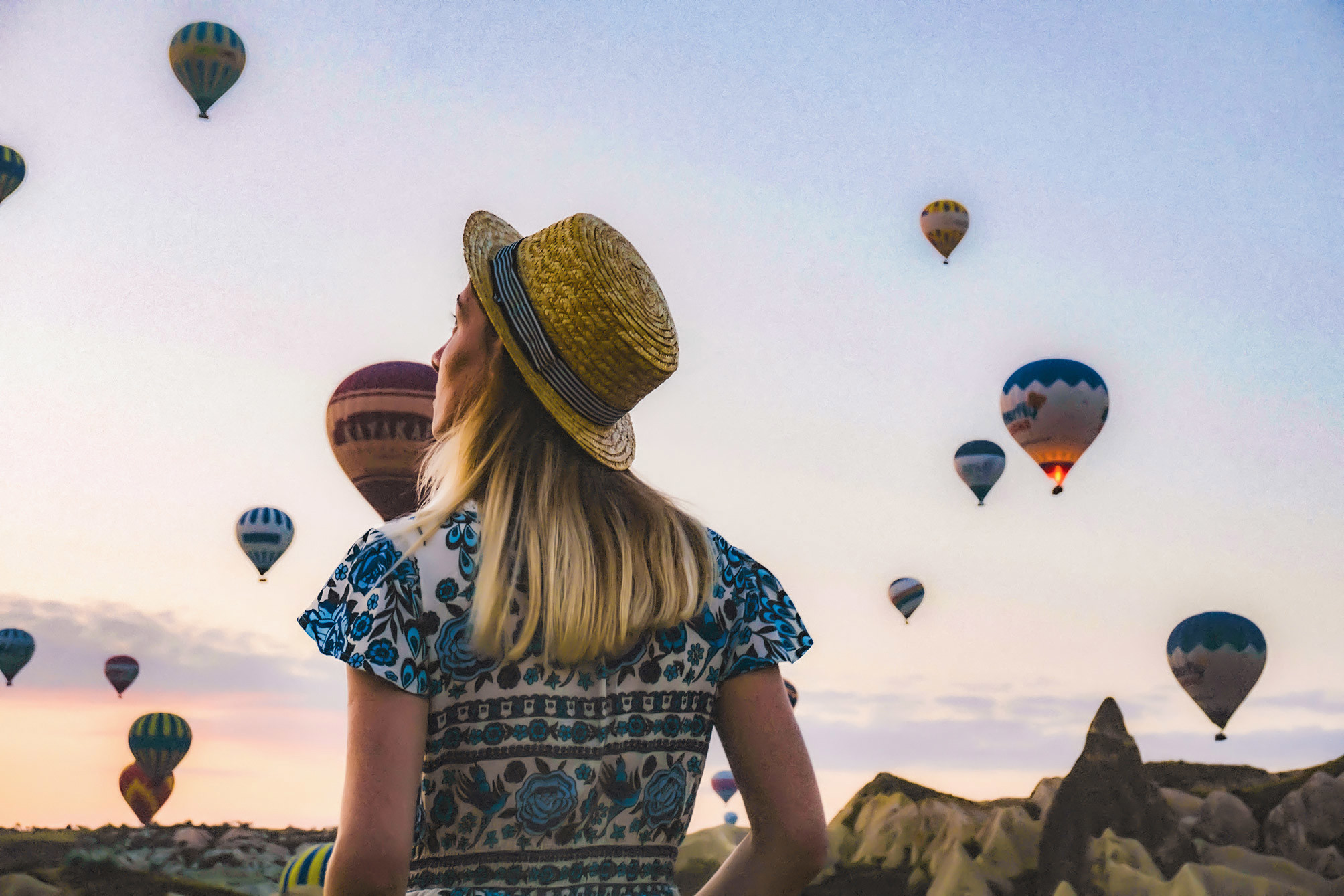 Traveller observing hot air balloons in Turkey