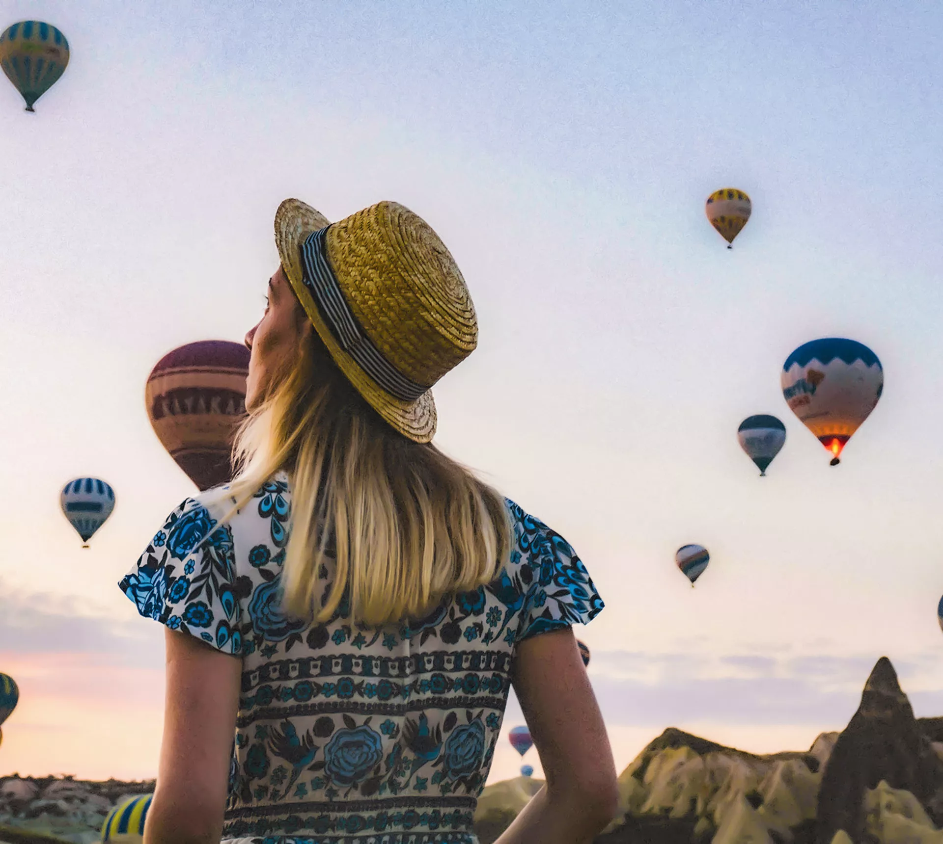 Traveller observing hot air balloons in Turkey