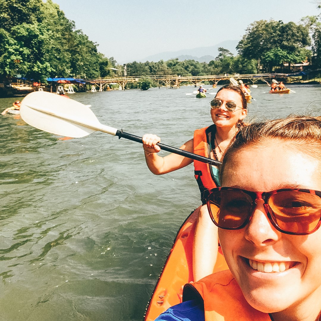 Travellers kayaking in Vang Vieng, Laos